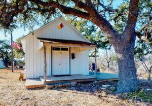 The outside view of the Honey Creek Schoolhouse, a wooden structure shoolhouse.